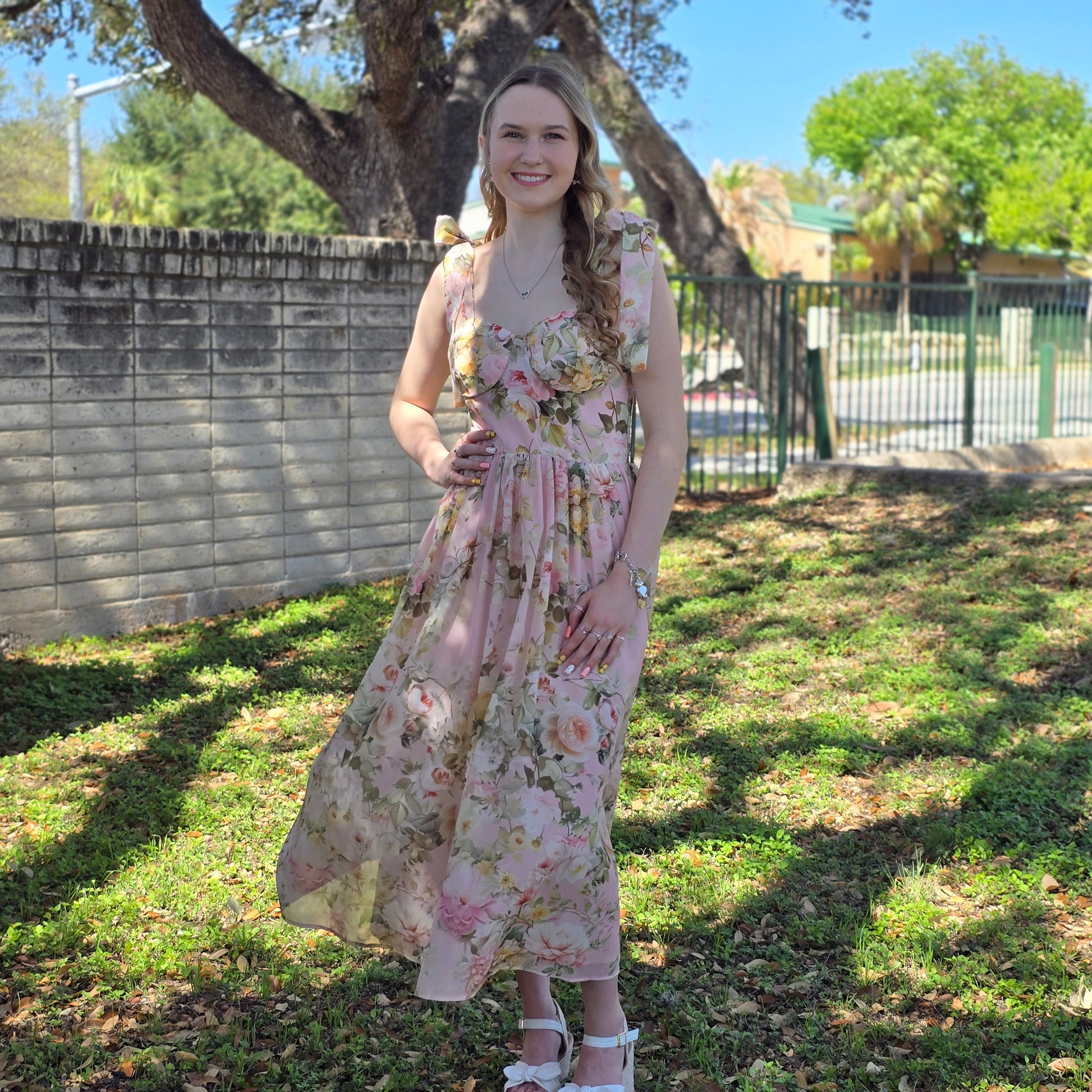 Floral midi dress in dusty blush or white with sweetheart neckline and flowy fit. Perfect for weddings, brunch, and special occasions.
