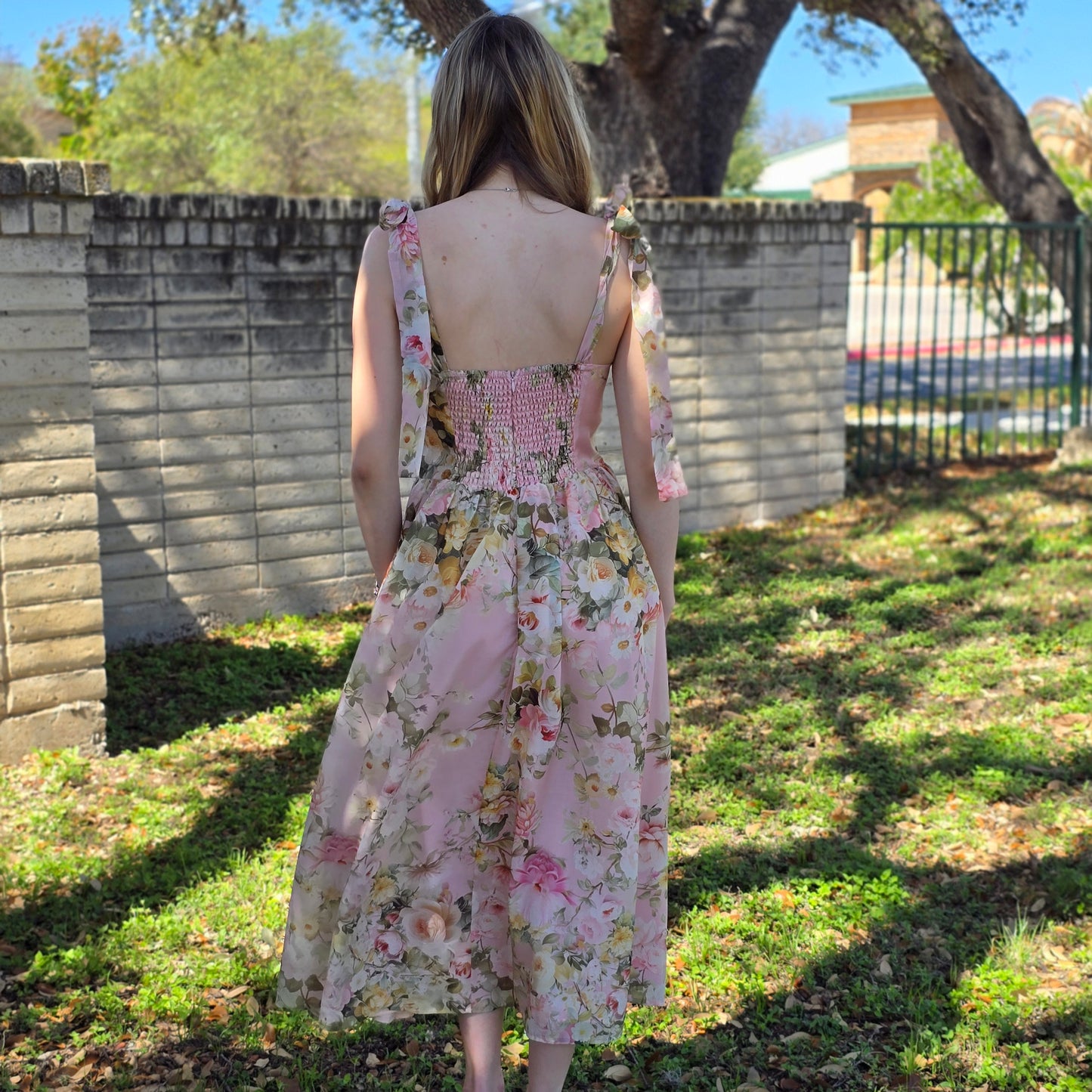 Floral midi dress in dusty blush or white with sweetheart neckline and flowy fit. Perfect for weddings, brunch, and special occasions.