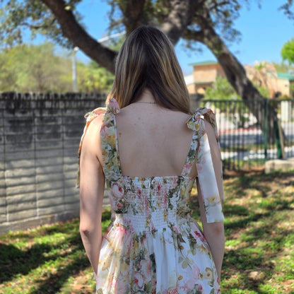 Floral midi dress in dusty blush or white with sweetheart neckline and flowy fit. Perfect for weddings, brunch, and special occasions.