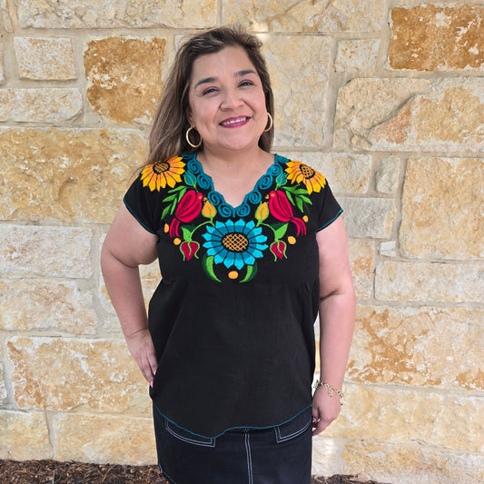 Fiesta embroidered blouse with colorful pajarito and floral design. Available in multiple colors. Lightweight top perfect for summer and Fiesta outfits.