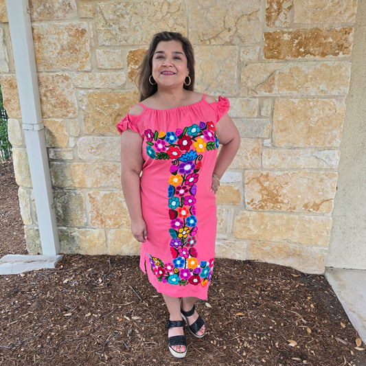 Fiesta embroidered dress with colorful floral design and off-shoulder neckline. Lightweight, vibrant dress perfect for Fiesta events and summer style.