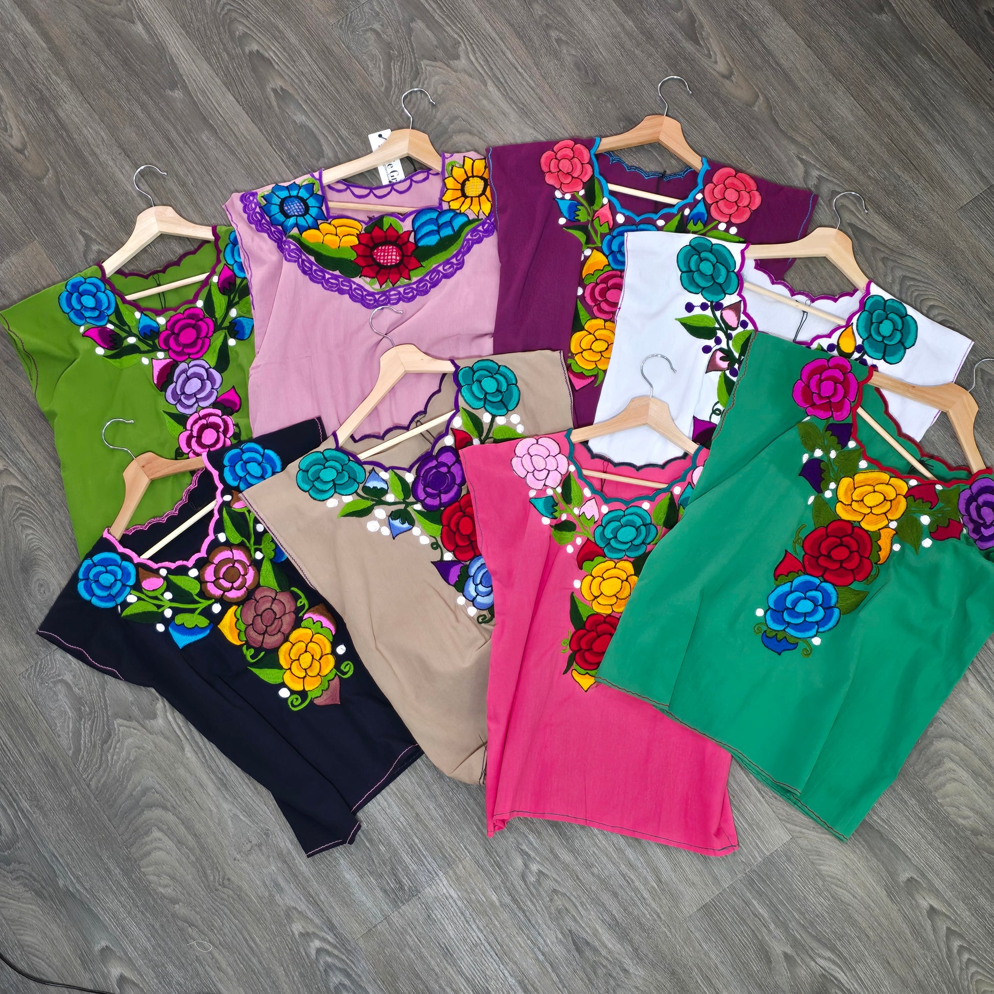 Bright embroidered Fiesta blouse with colorful floral design. Lightweight, vibrant top perfect for Fiesta outfits, summer style, and everyday wear.